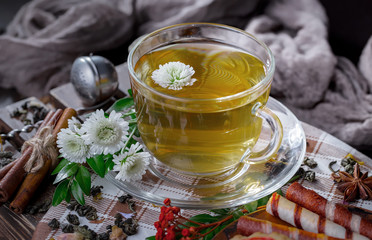 Tea hot drink on old background in composition on the table