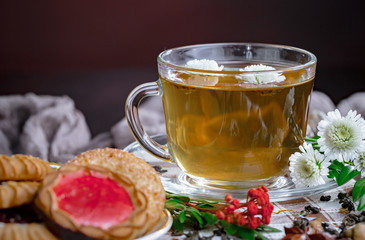Tea hot drink on old background in composition on the table