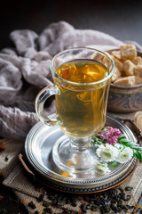 Tea in a cup on an old background
