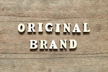 Letter block in word original brand on wood background