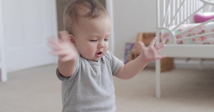 10 Month Old Baby Clapping and Smiling Happily at Camera