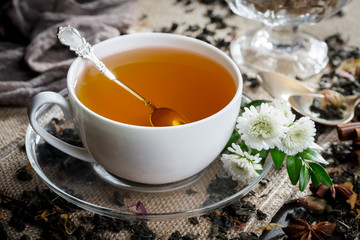 Tea hot drink on old background in composition on the table