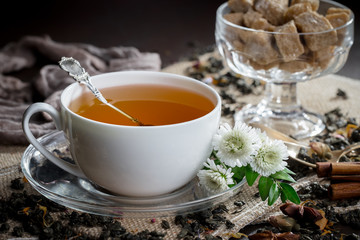 Tea hot drink on old background in composition on the table