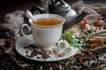 Tea hot drink on old background in composition on the table