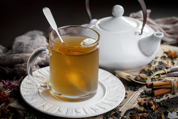 Tea hot drink on old background in composition on the table