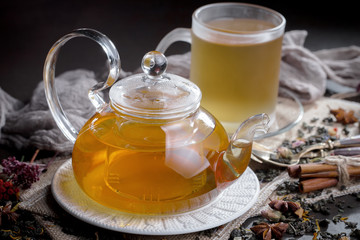 Tea hot drink on old background in composition on the table
