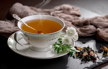 Tea hot drink on old background in composition on the table