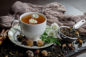 Tea hot drink on old background in composition on the table