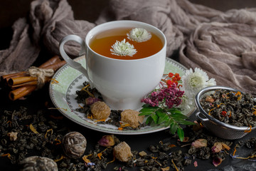 Tea hot drink on old background in composition on the table