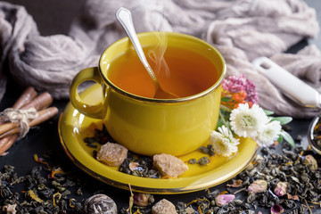 Tea hot drink on old background in composition on the table