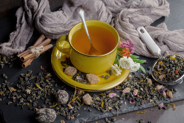 Tea hot drink on old background in composition on the table