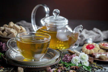 Tea hot drink on old background in composition on the table