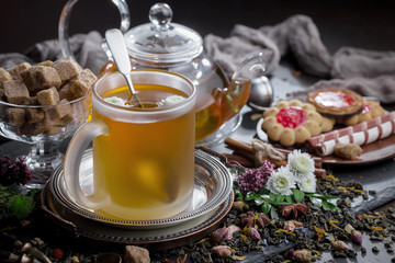 Tea hot drink on old background in composition on the table