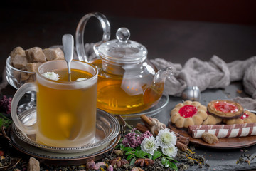Tea hot drink on old background in composition on the table