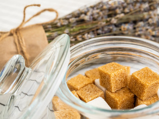 Different sugar cubes and dried lavender flowers