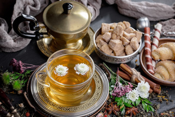 Tea hot drink on old background in composition on the table