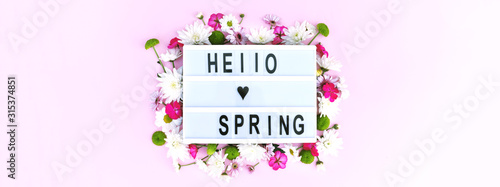 Banner for the site with a lightbox and the inscription hello spring.