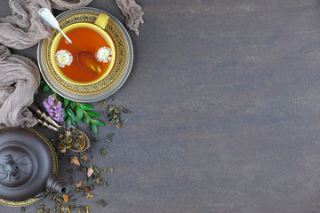 Tea hot drink on old background in composition on the table