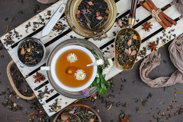 Tea hot drink on old background in composition on the table