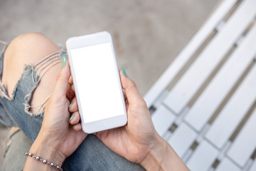 Mockup image blank white screen cell phone.man hand holding texting using mobile on desk at coffee shop.background empty space for advertise text.people contact marketing business,technology 