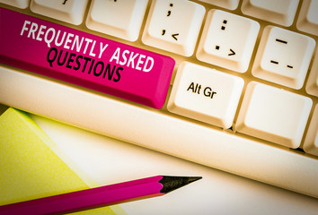 Conceptual hand writing showing Frequently Asked Questions. Concept meaning inquries that been informed more than one time White pc keyboard with note paper above the white background