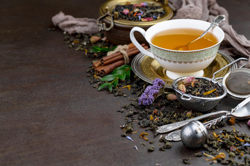 Tea hot drink on old background in composition on the table