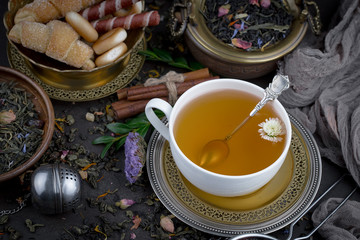 Tea hot drink on old background in composition on the table