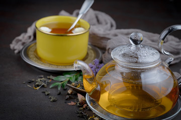 Tea hot drink on old background in composition on the table