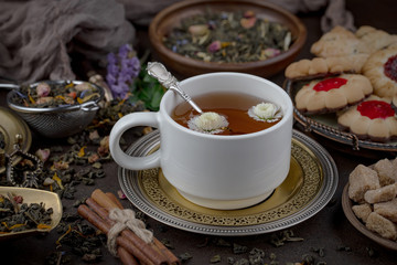 Tea hot drink on old background in composition on the table