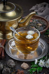 Tea hot drink on old background in composition on the table