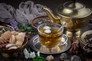 Tea hot drink on old background in composition on the table