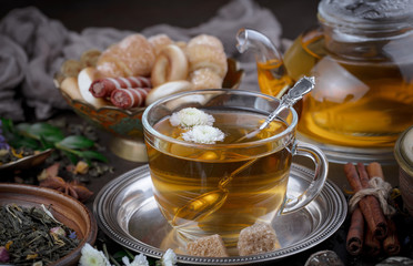 Tea hot drink on old background in composition on the table