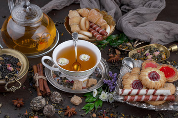 Tea hot drink on old background in composition on the table