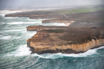 Helicopter aerial view of Great Ocean Road during a storm - Port Campbell, Australia