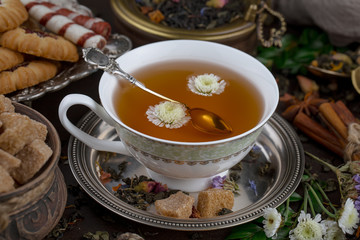 Tea hot drink on old background in composition on the table