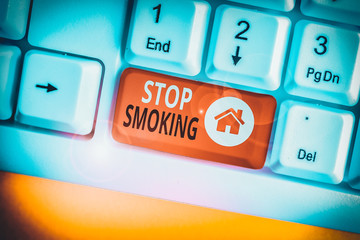 Conceptual hand writing showing Stop Smoking. Concept meaning the process of discontinuing or...