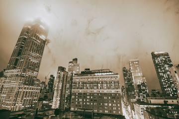 NEW YORK CITY - DECEMBER 2018: Manhattan night skyline with tall skyscrapers