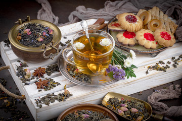 Tea hot drink on old background in composition on the table