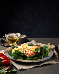 Cyprus fried halloumi cheese with healthy green salad. Lchf, pegan, fodmap, paleo, scd, keto diet.