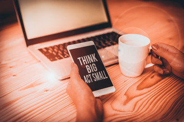 Writing note showing Think Big Act Small. Business concept for Great Ambitious Goals Take Little...