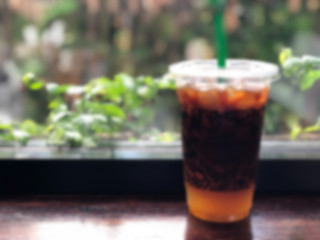 Blur background espresso shot mixed with orange juice