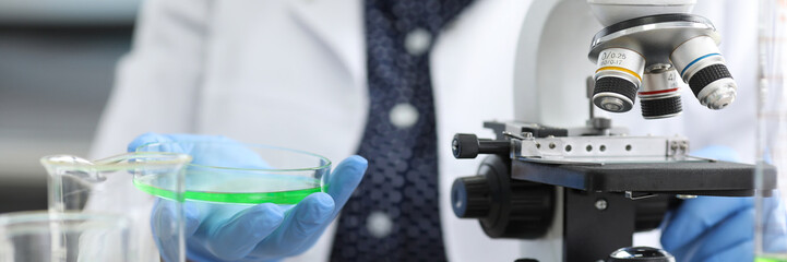 Biologist investigates sample in lab