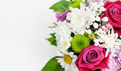 Fragment of a bouquet of fresh flowers on a white background. Blank for cards, congratulations