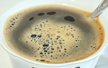 hot coffee in a white cup