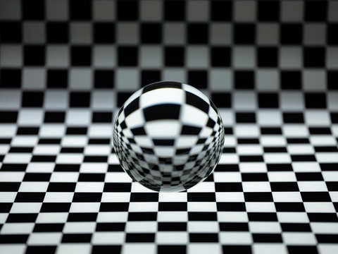 Crystal ball on a checked background