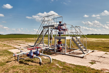 Gas well with piping system and measuring instruments