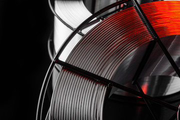 welding wire, stainless steel, on a black background