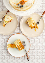 Homemade carrot cake dessert served on three plates. Top view