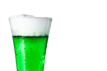 Traditional St Patrick's Day green beer isolated on white background. Copy space