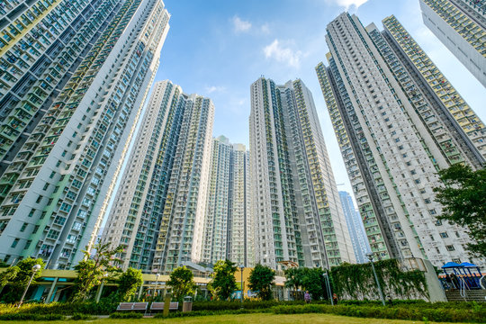 huge residential building complex, green court betweern high-rise apartment buildings